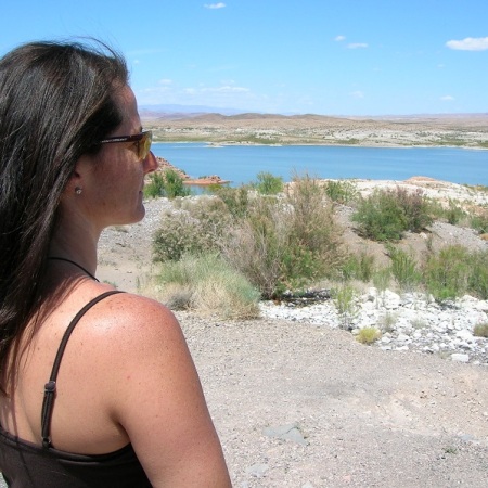 A woman looks out over the Colorado river.